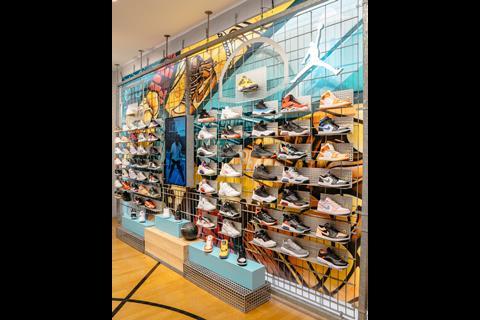 Brightly coloured rack of trainers on wall of Foot Locker Brixton store